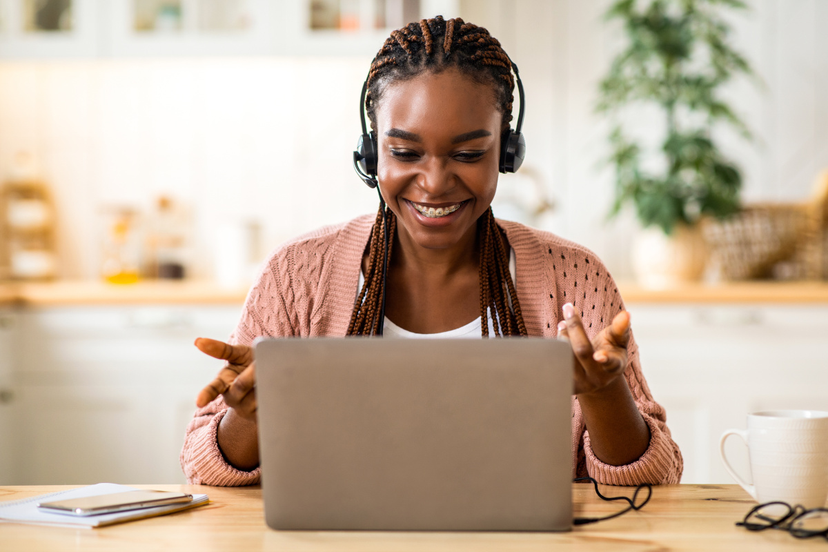 Woman with braces talking on virtual meeting